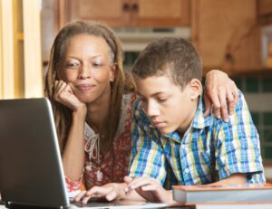 Mother And Son Using Computer